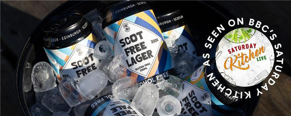 Bottles of Scot Free Lager with ice cubes on a dark surface, featuring BBC's Saturday Kitchen logo.